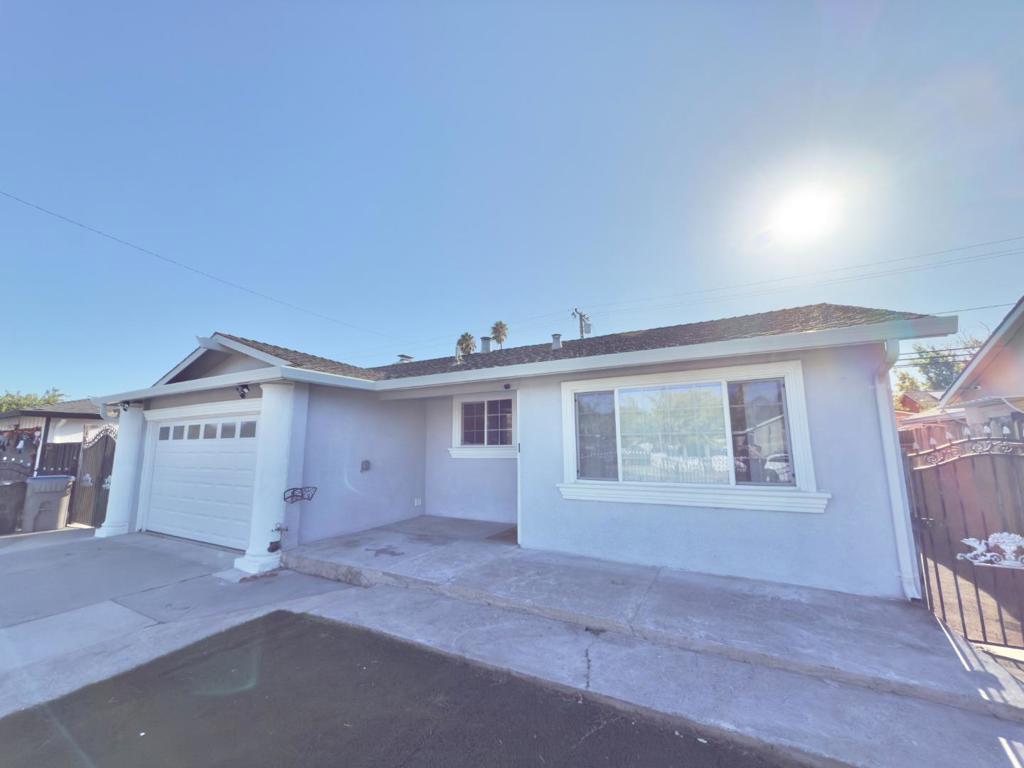 Welcome to this beautifully updated single-story home nestled in one of San Jose's most family-friendly neighborhoods. Spanning over 1,280 sq. ft., this rare four bedroom two full bath single-level gem offers a bright and airy layout featuring a formal living room, family room, and dining area all filled with natural light streaming through energy-efficient windows. The open flow creates a warm and inviting atmosphere, perfect for both everyday living and entertaining guests. Key highlights include: central air conditioning and heating, an in-home washer and dryer, a low-maintenance front and backyard with artificial turf, and a spacious two-car garage for everyday convenience. The private primary suite offers a peaceful retreat with an en-suite bath, while the cozy kitchen showcases premium stainless steel appliances, sleek granite countertops, and abundant cabinetry for all your culinary and storage needs. Step outside to your own backyard oasis, ideal for quiet relaxation or hosting gatherings with friends and family. Perfectly situated just minutes from shopping, the future San Jose BART station, scenic parks, public transit, and major highways, this home offers the perfect blend of comfort, style, and convenience truly embodying the best of San Jose living.
