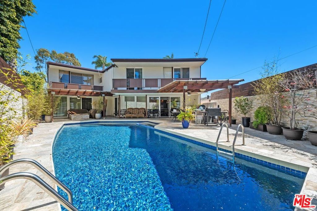 Welcome to this exquisite Mid-Century Architectural gem, presumed to be designed by architect Charles W. Wong, nestled in the prestigious Ladera Heights neighborhood. Offering over 5,600 square feet of spacious living, this home boasts 5 generously sized bedrooms and 4.5 luxurious bathrooms, ensuring ample space for both relaxation and entertainment. As you step into the light-filled living room, you'll be captivated by the soaring two-story ceiling and expansive windows, creating an airy and open atmosphere. The family room is complete with a pool table and a wet bar that is perfect for fun game nights at home! This lovely home features three fireplaces, one in the living room, another in the family room, and a third in the primary bedroom, adding warmth and character to each space. Upstairs, a huge bonus room awaits, perfect for an exercise space, additional family room, or whatever suits your lifestyle. The flexible layout offers endless possibilities for customization. The backyard is truly a private oasis, featuring a sparkling pool and patio area ideal for outdoor entertaining or unwinding in your own tranquil retreat. The three-car garage provides ample space for your vehicles and storage, while the fabulous location within the neighborhood offers both convenience and charm, with easy access to nearby shops, restaurants, and more. This home is a rare find! Come by today and experience the blend of timeless architecture and modern luxury in one of L.A.'s most desirable neighborhoods.