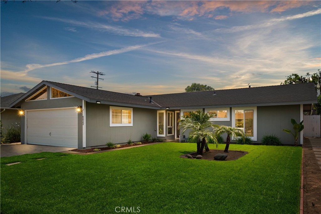 Welcome to this beautifully updated single-story home located in one of the most convenient and desirable pockets of Huntington Beach. As you arrive, you're immediately impressed by the freshly landscaped and manicured front yard, with 18x18 stepping stone pathway. A newly installed front door welcomes you inside, where you'll be greeted by wide-plank luxury vinyl flooring in a warm tones, fresh interior paint, and a spacious open floorplan bathed in natural light. The living and dining areas flow effortlessly into the heart of the home—a remodeled kitchen designed for both everyday living and entertaining. Enjoy a custom sit-up breakfast counter, sleek quartz countertops, all stainless steel appliances and a bay window that brings in even more sunlight. The cabinetry has been freshly painted and updated with new hardware, soft-close drawers, and a Lazy Susan to maximize storage. Custom pendant lighting adds style, while a deep stainless steel sink and microwave/hood combo complete this impressive space. Beyond the living room is a large and inviting family room centered around one of two cozy fireplaces. A sliding glass door that opens to the private, low-maintenance backyard, a space offering indoor-outdoor living at its best. Whether relaxing under the café lights, enjoying the block wall-enclosed yard, or staying cool inside with the high-performing central HVAC system, comfort is felt throughout all 1,681 square feet of living space. The home features 3 bedrooms, each with dual mirrored closet doors. Bedroom three offers French doors with direct access to the backyard—perfect for guests, a home office, or additional living flexibility. The primary suite is a true retreat, offering a fully renovated ensuite bathroom with a tile and glass walk-in shower, low-flow toilet, updated lighting, and a Bluetooth speaker fan with color-changing mood settings. The hall bathroom has also been tastefully updated with tile flooring, a glass-enclosed tub and shower combo, and modern lighting. Additional touches like new baseboards, all new dual-pane vinyl windows, recessed LED lighting throughout, a new raised-panel door package, and direct access to the oversized two-car garage reflect the upgrades that define this home. Located within walking distance to Helen Stacey Middle School, Clegg-Stacey Park, and just minutes to the 405 Freeway, shopping, dining, and a quick drive to the surf, sand, and sun of SoCal's best beaches—this is the one you’ve been waiting for.
