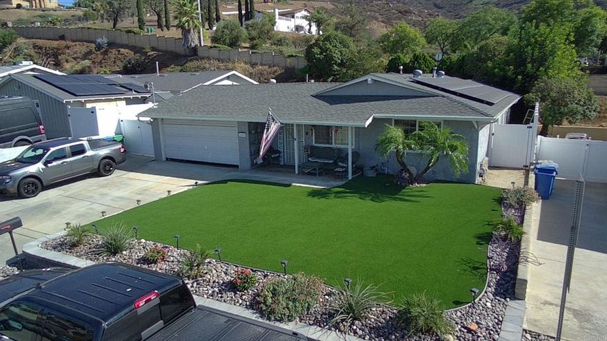 FIRST SHOWINGS at OPEN HOUSE, SATURDAY, Oct 11th 1-4pm and on SUNDAY Oct 12th, 2-5p. Wow! This one is a must see—one of the largest homes in peaceful and secluded Shadow Hill Terrace community of Santee. Benefit from no neighbors behind as Shadow Hill Park is directly behind home across the street. True pride of ownership shows with the extensive recent upgrades including low maintenance artificial turf, new stone retaining walls in front and back, drip irrigation lines, solar system with battery backup, new HVAC and condenser units, upgraded attic insulation, ceramic tile flooring throughout entire home except bedrooms, new sliding doors, new gutters, new paint throughout, brand new carpet in bedrooms, and more! This 3 bedroom, 2 bath home features an significantly oversized primary bedroom with en suite bath and a very generous living/common area room perfect for entertaining. Extra wide driveway provides ample space for toy storage or RV parking. Buyer has option to buy cash/new loan, or offer to take over $2650/mo payment on 2.25% ASSUMABLE loan with cash/funds down to cover difference between sale price and assumed loan balance. (Current balance is ~$450k and buyer does NOT need to have VA eligibility/entitlement to assume this VA loan).