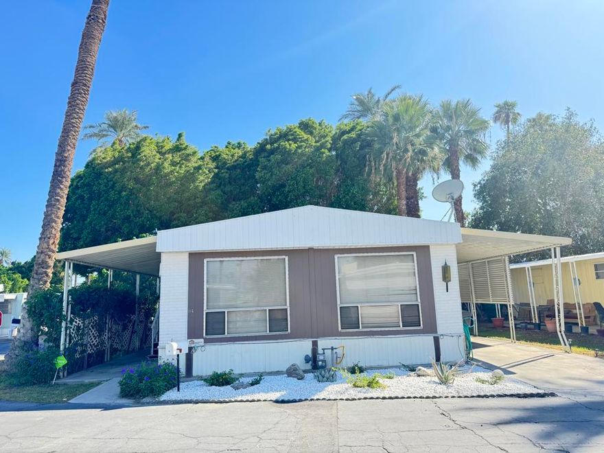 Welcome to a cozy and affordable Manufactured Home in the 55+ Park called Riverdale Estates located near La Quinta & Indio on Hwy 111. This corner lot home features 2 bd, 2 baths with a nice living area. Enjoy the kitchen with plenty cabinetry, laundry area inside. Some updates are completed such as new painting in the interior, carpet on the living area, and   bedrooms, stairs from both sides. Seminew AC unit, and nice landscaping with gravel at front, sprinklers to keep the beauty. Community amenities are club house with onsite office, laundry, pool, spa, gated community for security and privacy. The space rent for new owners will be $785.00, includes space, water, sewer, trash, plus electric & gas. Owners' occupants only. Buyers must be approved by the office. Ready to show it! bring your offer!
