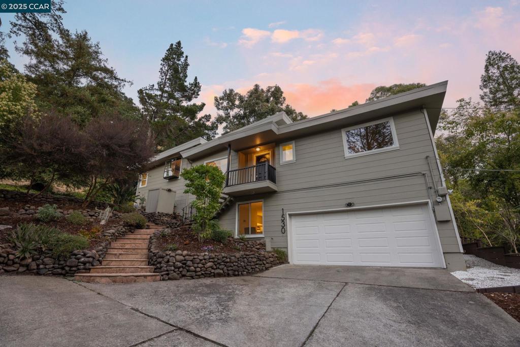Modern retreat with views, light, and luxury in the heart of Lafayette’s coveted Reliez Valley! Thoughtfully upgraded, this home offers vaulted ceilings, sunlit living spaces, and views from every room - from rolling hills to gorgeous trees. The chef’s kitchen is the heart of the home, featuring a gas cooktop island, granite countertops, white cabinetry, and garden window. French doors on either side of the house open provide a great indoor outdoor connection to a spacious deck and a large patio, perfect for entertaining or relaxing outdoors. Bamboo floors flow throughout the main level with a spacious great room, two primary suites, two additional bedrooms, and 3 full bathrooms. Downstairs offers in-law potential or flexible space for guests, work, or play. The expansive lot also includes a level lawn, play areas and room to add an ADU if city permits. Enjoy Lafayette’s top-rated schools and a gorgeous setting in the lovely Reliez Valley!