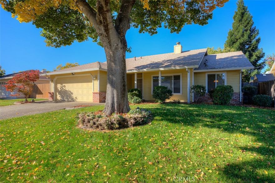 Seller is offering a $5,000 credit for carpet or flooring!!! Welcome to this beautiful home in the highly sought-after Little Chico Creek Estates subdivision. Conveniently located just steps from Baroni Park, Meriam Park, shopping, and schools, this home offers 3 bedrooms and 2 bathrooms encompassing 1,848 square feet of thoughtfully designed living space. A formal living and dining room set the stage for elegance, while the open-concept layout allows the kitchen to flow seamlessly into the breakfast nook and family room, creating a warm and inviting atmosphere. You’ll love the picturesque windows in the kitchen, abundant cabinetry and counter space, recessed and pendant lighting, and a spacious kitchen island—perfect for cooking, entertaining, or gathering with family and friends. The adjoining family room features a cozy fireplace, making it the perfect spot to unwind after a long day or enjoy a quiet evening at home. The primary suite provides a peaceful retreat, featuring two spacious closets and an ensuite bath with a double-sink vanity, a separate soaking tub, and a shower, along with additional cabinetry for storage. A set of French doors offers direct access to the backyard, creating the perfect space to enjoy your morning coffee or a quiet evening outdoors. Two generously sized bedrooms offer plenty of space for family, guests, or a home office. The guest bathroom also includes a double-sink vanity for added convenience, and the home features an individual laundry room with ample storage and workspace. Step outside to an incredible backyard oasis, where a charming covered patio is surrounded by beautifully mature landscaping—creating the perfect space for outdoor enjoyment. A dedicated side area is ideal for garden beds, offering the opportunity to add your own personal touch to this serene setting. Additional upgrades include a newer roof, newer water heater, new garbage disposal, and gutter guards for added peace of mind. Call your favorite Realtor today to schedule your showing!