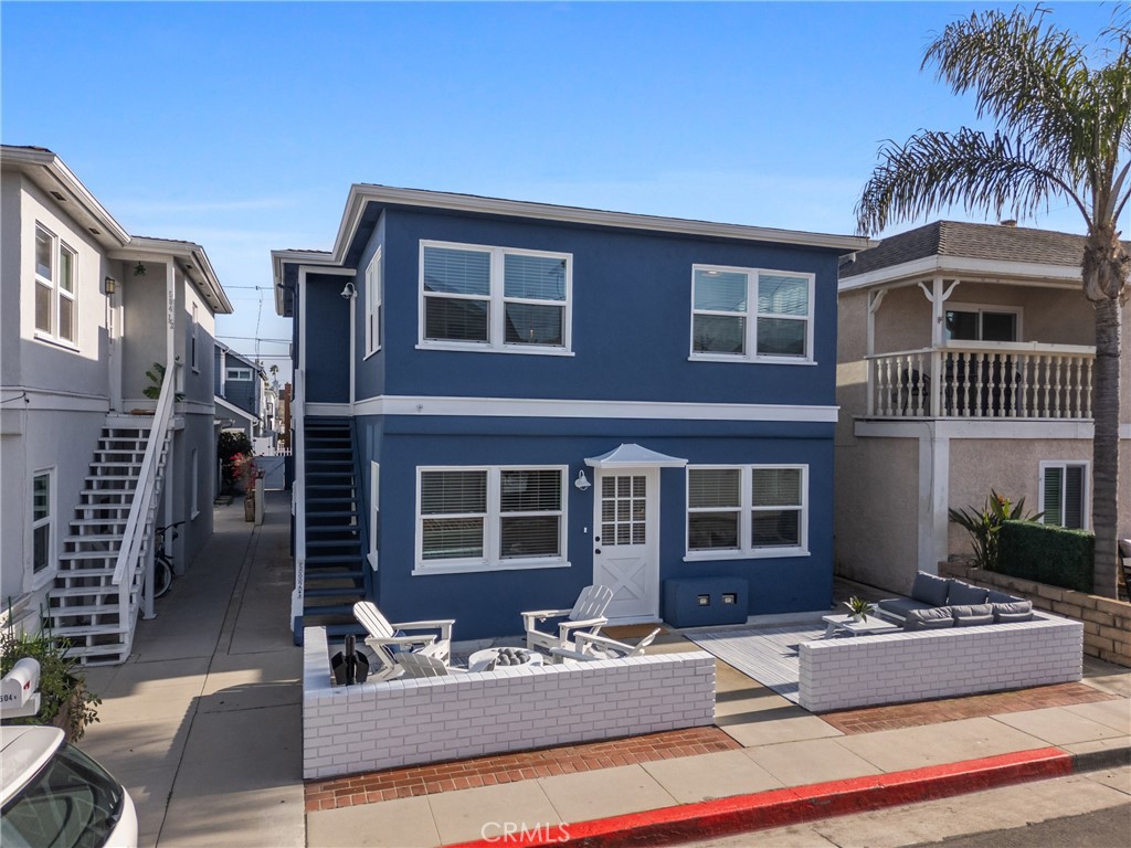 Unit B: Upper-Level Charm with Peekaboo Water View. Across the street from canal and amazing location adjacent Lido Marina Village. Experience bright and airy living in this 2-bedroom, 1-bathroom upper-level unit, offering approximately 900 square feet of refined space and delightful peekaboo water views. Abundant natural light floods the interior through numerous large windows, complementing the elegant luxury vinyl and tile flooring throughout. The beautifully appointed kitchen features quartz countertops, custom cabinets with newer hardware, and a gas burner stove/oven combo. The adjacent dining area is enhanced by wainscoting and a custom light fixture. Two spacious bedrooms offer comfort with ceiling fans and built-ins. The remodeled bathroom provides quartz countertops, new fixtures, and a convenient tub/shower combo unit. This unit includes one dedicated garage space in the shared two-car garage. Enjoy the fresh air on your private back patio upstairs. Shared coin-operated laundry facilities are available in the garage. Situated within short walking distance of Lido Marina Village, this location offers unparalleled access to exclusive destinations like Lido House, Nobu, premium retail, and acclaimed restaurants, embodying the quintessential Newport Beach experience. Pets are considered, please contact agent for details.