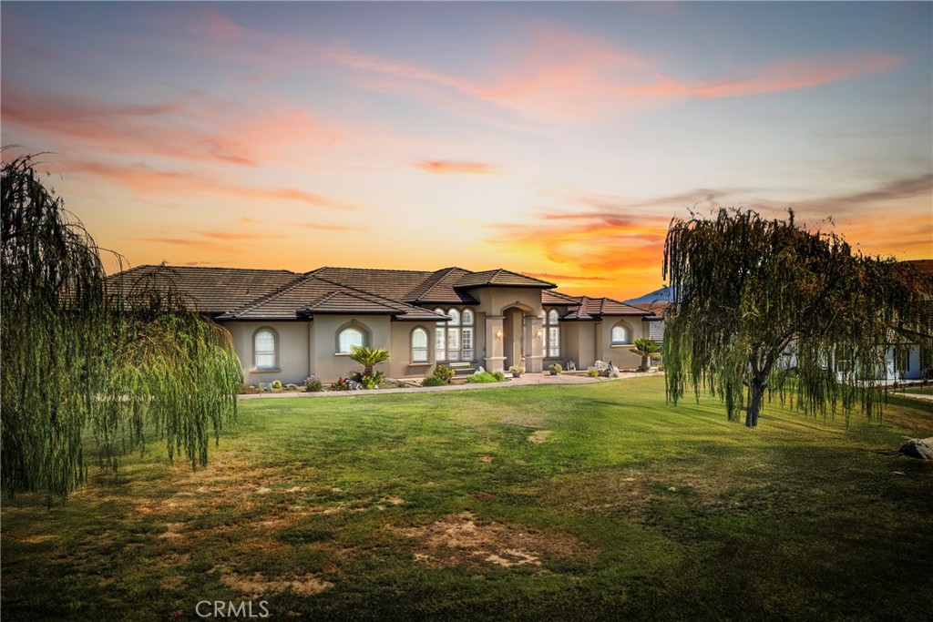 Welcome to this beautiful 3,292 sq. ft. residence located in a desirable gated community, just minutes from the foothills and the Kern River. This spacious 4-bedroom, 2.5-bathroom home offers the perfect blend of comfort, style, and functionality. Step inside to find two expansive living areas, a formal dining room with exposed wood beams and a gourmet kitchen with Viking appliances, center island and breakfast bar designed for both everyday living and entertaining. A wet bar adds a nice touch of elegance, perfect for gatherings with family and friends. Outdoors, enjoy a large covered patio that overlooks a large backyard, beautiful views of the foothills providing plenty of space for relaxation or entertaining. The property also features a 1800 sq. ft. shop with roll-up doors, 3/4 bath and a lift for cars ideal for hobbies, storage, or a business setup. With its prime location, generous layout, and incredible amenities, this home is a true gem offering both luxury and practicality.
