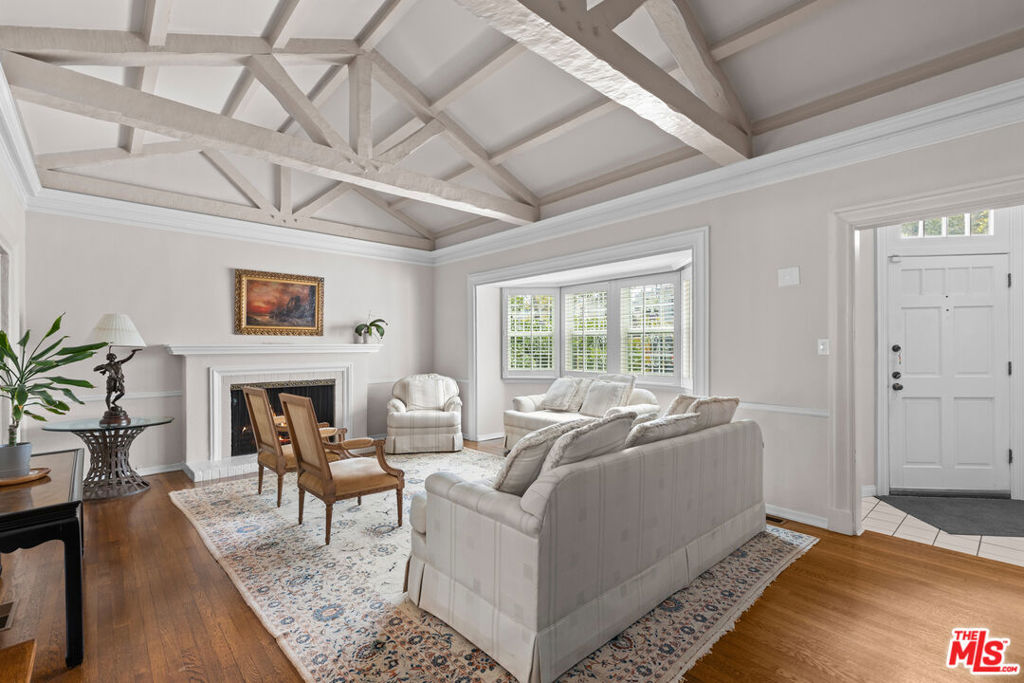 What makes this home truly extraordinary begins the moment you walk through the door. A thoughtfully permitted entryway with soaring ceilings and space to pause - drop your keys, take a breath -sets the tone for what's to come. Step into the formal living room, where comfort and elegance meet. The heart of the home features a spacious, permitted family room perfect for relaxing, entertaining, or both. Whether you're enjoying a quick bite in the kitchen or hosting a dinner for ten in the formal dining room, there's room here for every moment. Just off the living room, discover a versatile bonus room currently used as a fourth bedroom, but ideal as a home office, playroom, game room, or quiet study. Lovingly cared for by the same owners for over 30 years, this Beverly Hills gem is filled with warmth, charm, and possibility. It's not just a house it's your next chapter. Come on home.
