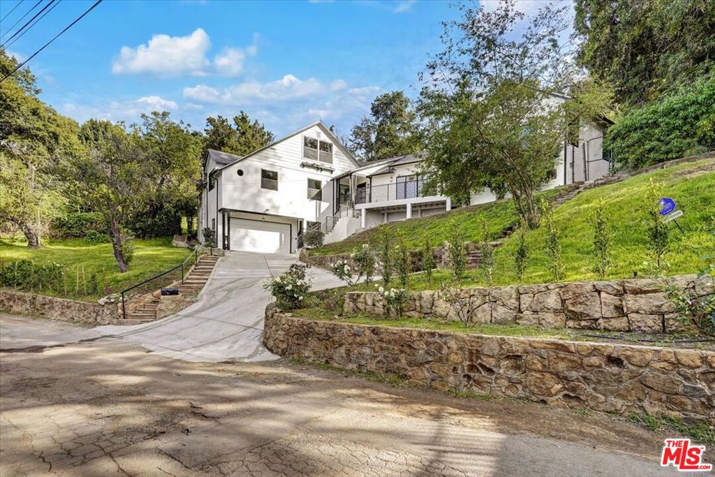 Incredible Hollywood Hills location, massive lot, quiet escape just minutes from DTLA and Universal Studios, walking from Celebrity Row. Recently remodeled, 4 bedrooms, 3 baths and a bonus room. 2 car garage and the driveway can hold several more cars. Great schools. Move in ready!