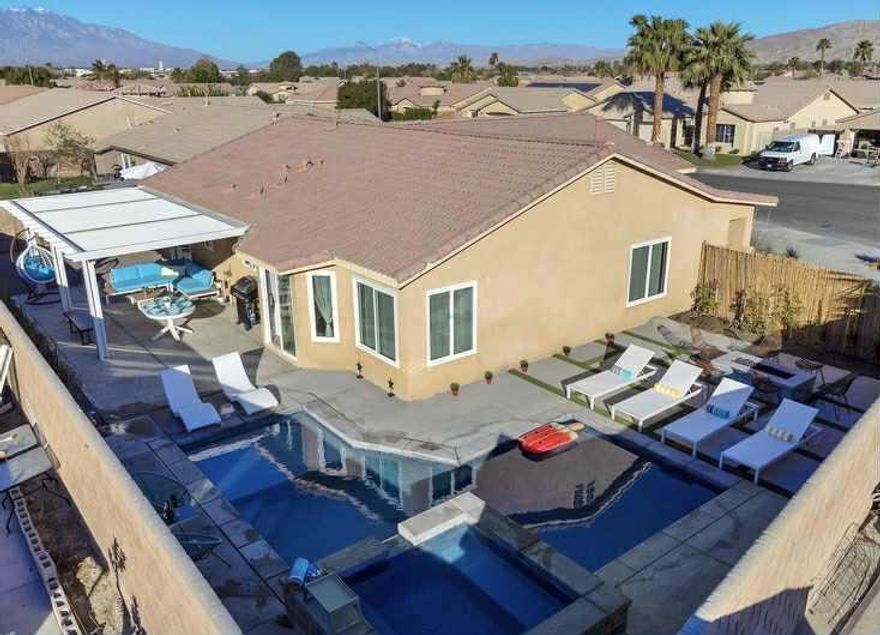 Available for long-term lease, tastefully furnished, with the option to lease unfurnished if furnishings can be stored in the garage at no additional cost.This recently refreshed home is move-in ready and located in a quiet neighborhood on a cul-de-sac, offering both privacy and stunning mountain views.The inviting backyard sets the stage for outdoor living, complete with a sparkling pool, spa, built-in fire pit, and multiple patios perfect for relaxing or entertaining.Inside, the bright and open floor plan features 4 bedrooms, 2 bathrooms, soaring ceilings, and central A/C for year-round comfort. The seamless connection between living, dining, and outdoor areas makes the home feel spacious and welcoming.Practical highlights include an attached 2-car garage and gated RV parking with full hookups - a rare convenience.Ideally situated near I-10 freeway access, golf courses, shopping, dining, schools, parks, and local entertainment.