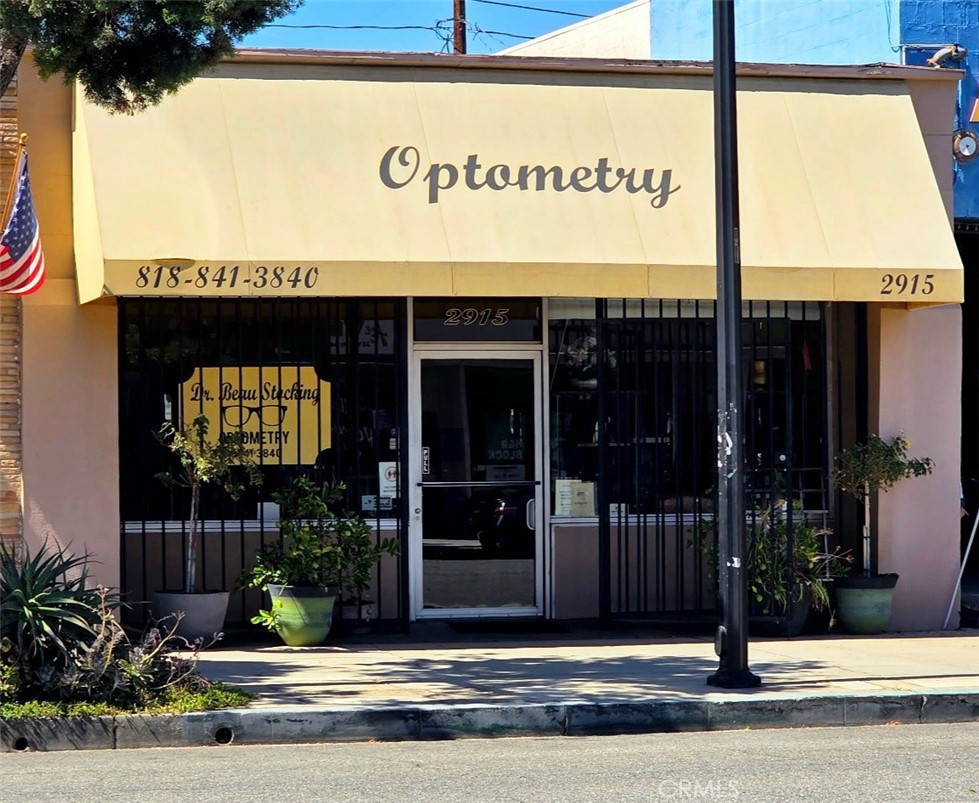Nestled in the heart of Magnolia Park, this 2,575 SqFt commercial building is full of potential and perfectly situated in one of Burbank’s most beloved neighborhoods. With its inviting Magnolia Boulevard frontage, this property offers fantastic visibility and walkability—surrounded by trendy boutiques, vintage shops, cozy cafés, and some of the city’s favorite eateries. Inside, you’ll find a flexible floor plan with several private offices, two restrooms, and a convenient storage loft at the rear of the building. Currently home to an optometry practice, the space is easily adaptable for a wide range of uses—whether it’s creative studios, wellness, professional offices, or a unique neighborhood storefront. The 3,375 SqFt lot includes four tandem parking spaces behind the building, making access easy for both staff and clients. This is a rare opportunity to plant your business in Magnolia Park, where community charm meets vibrant foot traffic and a true local vibe.