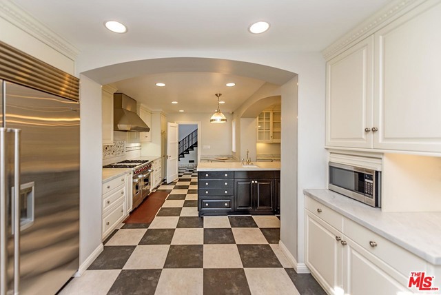 The gated property is secure, private and surrounded by mature trees.