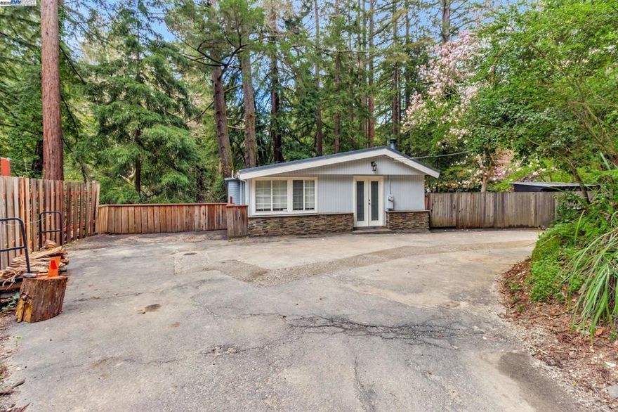 Welcome to 17835 Hwy 9 in the heart of Boulder Creek! This charming single-family home combines comfort and style with nature's beauty sitting on a massive 11,000+ sqft lot! This fully furnished residence offers 1,341 square feet of living space, featuring three spacious bedrooms and two well-appointed bathrooms, including a serene primary ensuite with a luxurious soaking tub. Step inside to discover the warm ambiance created by the laminate and ceramic floors, complete with cozy working fireplace, perfect for relaxing evenings. The open kitchen is a culinary enthusiast's dream, equipped with modern appliances such as a dishwasher, electric stove, range hood, and refrigerator, alongside a convenient kitchen dining area for gatherings. The property's outdoor amenities are perfect for entertaining, with a built-in barbecue and a generous deck ideal for enjoying the surrounding scenery. Additional storage space ensures you have room for all your essentials. On-site parking offers convenience for multiple vehicles. This Boulder Creek gem is a perfect blend of functionality and natural beauty, inviting you to experience a comfortable and stylish lifestyle. Don’t miss the opportunity to make this remarkable home your own. Happy Shopping!