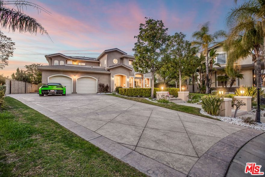 OFFERS DUE BY FRIDAY 4/14, 5p. Fabulous & immaculate 5bd/5 bath 4,800sf home with resort style pool & spa at the end of a cul-de-sac of a gated Chatsworth community close to Porter Ranch! Beautiful park-like grounds including cabanas, fire pits, waterfalls, outdoor BBQ kitchen and a sandy playground with swing set make this an amazing house for entertaining the family and guests. Step inside and be greeted by 20+ft ceilings in your formal voluminous living room with fireplace, formal dining room with TV and spacious family room with fireplace that opens to your chefs kitchen with breakfast bar, breakfast area and center island, all with double sliders that open up to the incredible yard. Downstairs also find 2 additional en suite bedrooms with walk in closets and back yard access. Take the circular staircase up and find the spacious loft and sumptuous Master bedroom with fireplace and retreat that has 2 large walk in closets, detached shower and soaking tub along with double vanities. Up also find two additional bedroom suites with generous patio. This home comes complete with surround sound Sonos speakers inside and out, solar panels for low utility bills, alarm system, tons of closets, 3 car garage with custom storage PLUS parking for 7+ cars on the driveway! A dream come true!