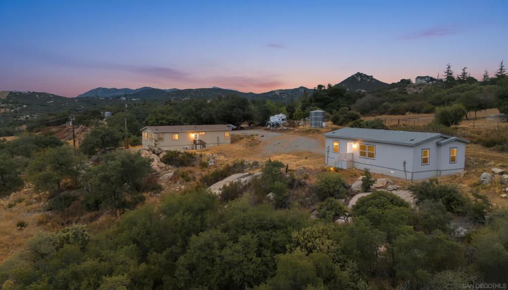 Ever dreamed of owning a private compound where life feels effortless and possibilities run wild? Here’s your chance. Nestled in the serene hills of Alpine, this rare offering includes two brand-new, turnkey homes resting on nearly nine acres of mostly flat, ranch-style terrain. Property includes 2 mobile homes on one lot. Share one for income or family, and keep one just for you—it’s ideal for multi-generational living or creating a peaceful retreat. With such generous acreage, you’re free to dream big: build a guest house, set up a shop or hobby area, ride horseback across your land, or simply soak in the wide-open vistas. All of this in a setting that balances peace and privacy with easy access to Alpine’s amenities and major highways. This isn’t just a property—it’s your next chapter, defined by freedom, flexibility, and endless possibility