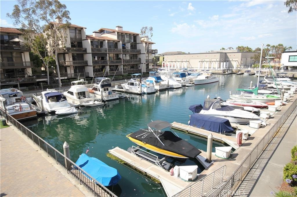 Enjoy the Good Life at the Exclusive 24 Hour Gate Guarded Marina Pacifica Waterfront Luxury Community . Highly Upgraded One Bedroom Condo features a contemporary split level design with aprx 926 sq ft , Stunning Views of the Pool Area and Yachts , Gorgeous kitchen has rich granite counters / custom white cabinetry / tile floors / stainless appliances ( refrigerator / flat top electric range oven stove / microwave / dishwasher ) , will be freshly painted in pure white , engineered wood flooring , bedroom has mirrored closet doors with closet organizers , wet bar , living room has a gas fireplace with stone accents , desk area , washer & dryer , central ac & heat , recessed lighting , view balcony , one underground assigned parking space , private bridge leads to the Marina Pacifica shopping center with fine dining & nightlife , steps from the new 2nd St PCH shops and the Marina Pacifica Mall / Whole Foods market / Gelson's market / Farmers Market , 18 acres of lushly landscaped grounds with tranquil fountains and Koi ponds / 6 pools & spas / clubhouse with fitness center . Close to Seal Beach / Naples / & Belmont Shores .