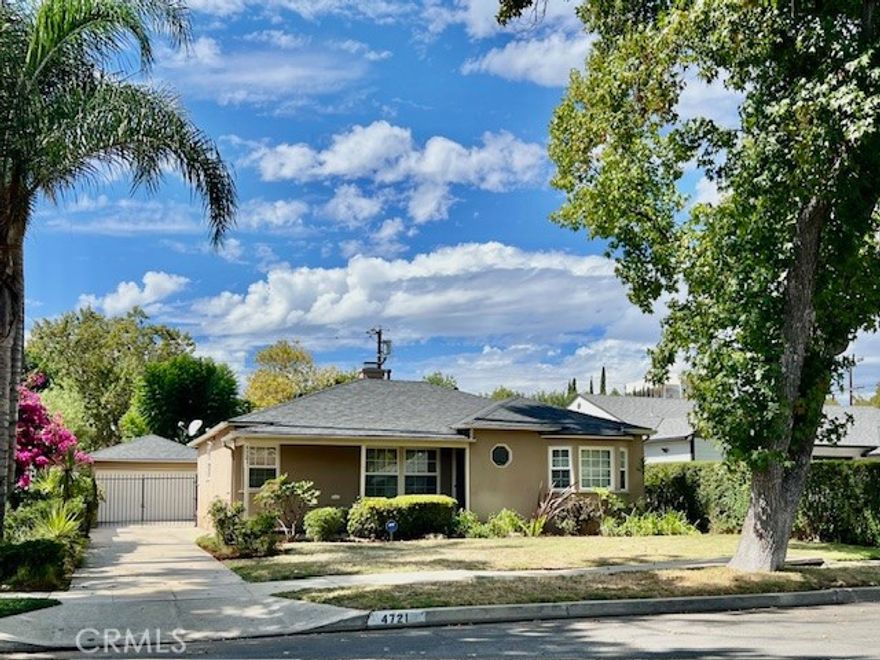 Immaculate, Spacious and Charming.  A true place to call home this 3 bedroom and 2 bath will satisfy every need.  The inviting entry opens to a large living room with natural light and a cozy brick fireplace.  A galley kitchen with new flooring, granite counters, travertine trim and glass tile backsplash includes a new 4-burner stove and grill with huge oven and vent, a new Bosch dishwasher and a conveniently located laundry area with stacked washer and dryer.  A large dining area adjacent to the kitchen spotlights a beautiful chandelier and wainscoting..perfect for formal or casual  entertaining.  Two large, bright bedrooms and one bath are accessed by a central hall.  An additional spacious bedroom with its own bath and slider to patio/yard access can double as an office or family room.  Additional amenities include central air and heat,  Newer Milgard Windows, window treatments, custom paint, newly glazed hardwood flooring, gated access to the garage and spacious rear yard.   A beautiful and centrally located home close to markets, shopping and transportation.  A must see!!