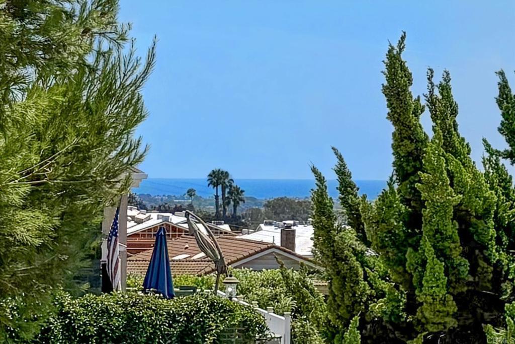 A True Fire Mountain Gem – Ocean Views & Endless Potential This is the one you’ve been waiting for! Located in the highly desirable Fire Mountain community of Oceanside, this charming single-story mid-century home offers nearly 1,900 sq ft of living space on over ¼ acre. Built in 1952 and lovingly maintained by the current owners for decades, it’s now ready for your personal touch—a fantastic opportunity to create your dream home. The home features 3 bedrooms, 2.5 baths, a central atrium, walk-in basement, crawl space, and a spacious deck off the kitchen with panoramic views of San Jacinto and surrounding mountains. Enjoy ocean views from the front of the home, living room, and front bedrooms, with the potential to enhance those views even further by trimming some of the mature landscaping. The home’s south-southwest orientation captures stunning natural light and refreshing ocean breezes. Modern upgrades include 4 mini-split systems and dual-pane windows for year-round comfort. The fenced yard is a private retreat with fruit trees, a workshop, and ample space for RV parking, an ADU, or even a swimming pool. The attached 2-car garage features a flat roof—perfect for a future rooftop deck to take full advantage of the ocean views. Just minutes from Carlsbad beaches, shopping, dining, and with easy freeway access, Fire Mountain is a welcoming, walkable neighborhood where residents enjoy a strong sense of community. Don’t miss this rare opportunity to own a slice of coastal paradise with room to grow and make it your own!