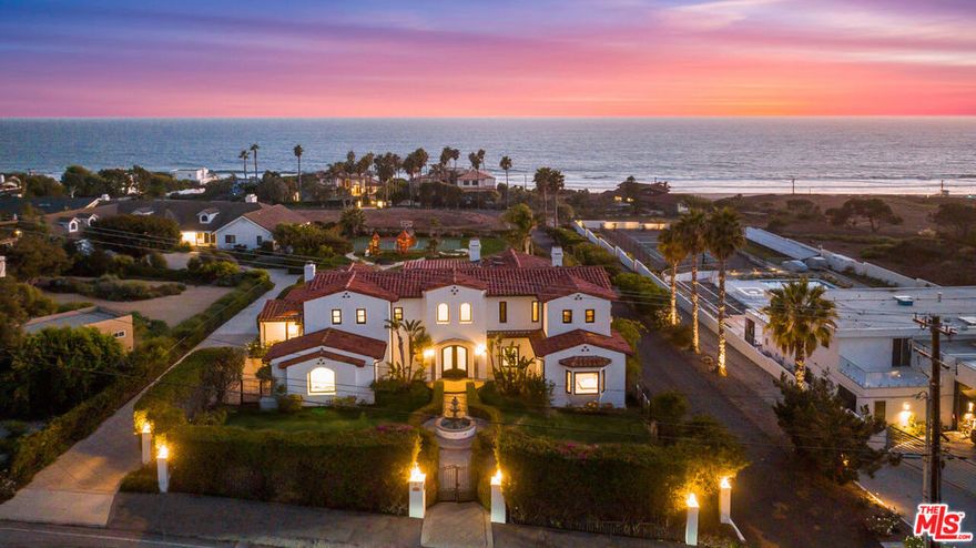 Located in the prestigious Malibu Park neighborhood, 30532 Morning View Drive offers sweeping ocean vistas and resort-style living. Behind private gates, this nearly one-acre Mediterranean estate spans over 5,000 square feet of interiors designed with scale and sophistication. Soaring ceilings, walls of glass, and sunlit living spaces highlight the dramatic views, while a chef's kitchen, formal dining, media room, and game room create the perfect blend of comfort and elegance. The primary suite is a private retreat with dual walk-in closets, a spa-like bath, and a terrace overlooking the Pacific, complemented by additional en-suite bedrooms that ensure luxury and privacy for family and guests.  The grounds are equally compelling, designed for seamless indoor-outdoor living with expansive terraces, manicured landscaping, and panoramic coastal backdrops. A sparkling pool and spa, sport court, fire pit, and a fully appointed outdoor kitchen and bar provide the ultimate setting for relaxation and entertaining. Within moments from Malibu's best beaches, dining, and schools, this estate delivers the perfect balance of privacy and convenience - an exceptional residence embodying the very best of coastal California living.
