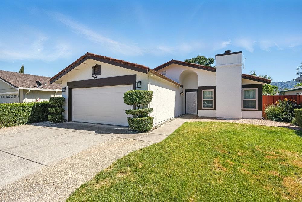 Welcome to this beautifully renovated single-story gem located in a peaceful Gilroy neighborhood. This home offers a perfect blend of modern elegance & functional living, just minutes from parks, schools, and shopping. Step inside to a bright, open living space featuring a cozy fireplace, recessed lighting, & soft natural light pouring through dual-pane windows. The heart of the home is the designer kitchen, complete with semi-custom cabinetry, quartz countertops, a stylish island, sleek black fixtures, and a spacious dining area perfect for everyday living and entertaining. The primary suite is a true retreat, boasting vaulted ceilings and a luxurious ensuite bath with dual vanity and a frameless walk-in shower. The hall bathroom is equally refined, with modern tile, black matte finishes, and a contemporary double-sink vanity. Additional highlights include: * Chefs kitchen with quartz countertops, custom cabinetry, and pendant lighting * Spa-like bathrooms with modern tile, dual vanities, and designer finishes * New luxury vinyl plank flooring throughout * Built-in wet bar with modern lighting and wood accent wall * Low-maintenance landscaping front and back This move-in ready home is the one you've been waiting for, thoughtfully updated with todays style and comfort in mind.