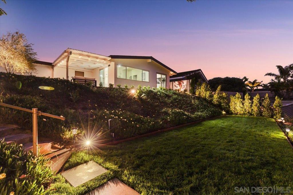 Canyon lot Stunner in Clairemont! Perched above a tranquil canyon, this beautifully upgraded 5 bed, 2 bath home offers sweeping views from the patio, living room, and office—perfect for soaking in golden hour sunsets or starting your morning with peaceful canyon serenity. By day, enjoy quick access to the beach and La Jolla’s vibrant dining scene. By night, retreat into your own private oasis that feels miles away from the city—like a secluded island escape in Hawaii. Inside, the home blends organic modernism with thoughtful design. The kitchen is a true showpiece, featuring a waterfall-edge quartz island with a breakfast bar and built-in beverage fridge, FORNO stainless steel appliances, custom cabinetry, a designer range hood, quartz countertops, and a pot filler—beautifully combining form and function. The spa-like guest bathroom offers a luxurious waterfall shower, while the living room is centered around a decorative marble tile fireplace, adding warmth and sophistication. Down the hallway, custom cabinetry with built-in accent lighting provides stylish storage, and the oversized garage gives you ample room for vehicles, gear, or a home gym. The versatile 5th bedroom can serve as a home office, guest room, or creative space. In the backyard, a charming shed provides additional flexibility—perfect for extra storage or a playful retreat. Conveniently located near top-ranked schools, Mt Etna Park, multiple shops and restaurants, don’t miss the chance to call this canyon-surrounded gem your home!