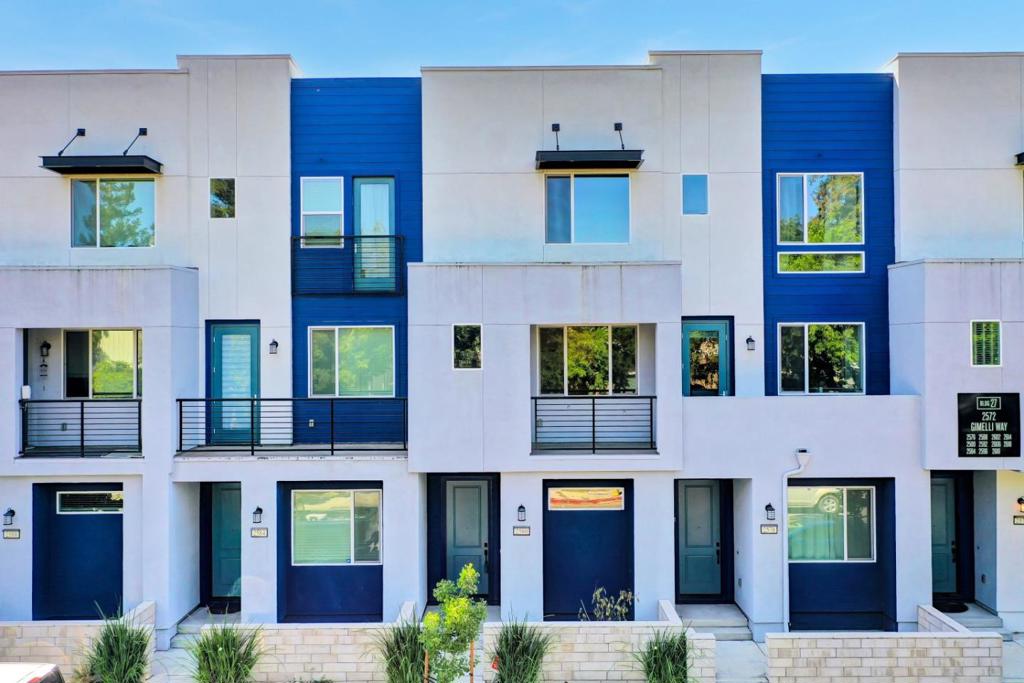 Experience Luxury living in this stunning 6 year new townhome style condo, featuring 3 bedrooms and 3 bathrooms, situated in a north facing direction. Built by Pulte, this home boasts high ceilings, recessed lighting throughout, and durable laminate flooring on the first and carpet second floors. The second floor is an entertainer's dream, showcasing a chef's kitchen with quartz countertops, stainless steel appliance, and large island-perfect for gatherings. The open-concept living and dining areas flow seamlessly onto a second patio, ideal for hosting or relaxing. The third floor features a luxurious primary suite retreat with walk in closet, spacious bathroom complete with a dual sink vanity and separate guest in-suite and laundry room. Easy access to outdoor recreation, school, local amenities, and Parks. Perfect for embracing the California lifestyle. With its proximity to Highways 680, 101 and 87.This home effortlessly combines convenience and style. This friendly community extends beyond the walls of your home, offering a city-managed park, BBQ area, private garden and children's playground. Enjoy the convenience of walking to top brand shops, grocery stores, and restaurants, along with easy access to public transit and freeways. Private schools nearby.