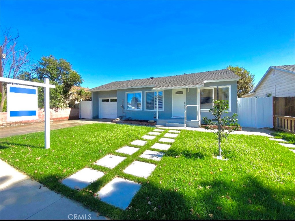 Discover this newly remodeled 3-bedroom, 2-bathroom home, ideally situated on a private cul-de-sac just off Balboa. This residence offers an inviting open floor plan, highlighted by a stunning kitchen featuring quartz countertops, new custom cabinetry, and stainless steel appliances. The primary suite includes a luxurious en-suite bathroom with a separate shower, soaking tub, dual sink vanities, and ample closet space. The expansive backyard presents a fantastic outdoor living area, offering generous space for entertaining. Enjoy modern comforts such as recessed lighting, elegant wooden floors, new dual-paned windows, a new roof, updated electrical, and a new AC system. Perfectly suited for a family, this home is conveniently located in the heart of Lake Balboa