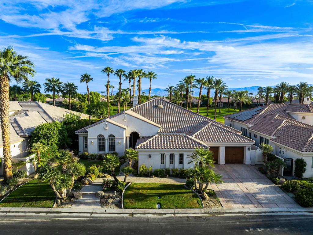 Stunning PGA West Legends Fairway Home - Sold Fully Furnished! Features 4BD/3.5BA including a spacious primary suite and 3 en-suites. Vaulted ceilings, quartzite floors, stacked-stone fireplace, formal dining area, and a family room with a wet bar and wine fridge. Gourmet kitchen with granite countertops, Sub-Zero appliances, pantry, and ample storage. Primary bath includes a soaking tub, dual vanities, travertine accents, and a walk-in closet. Resort-style backyard with mountain and golf course views, covered patio, BBQ island with palapa, oversized saline pool and spa with waterfalls. Move-in ready and sold furnished per inventory!