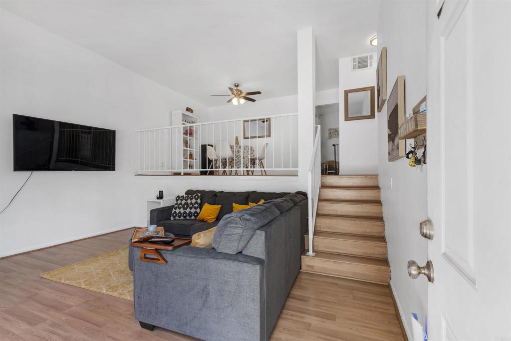 Step into this spacious, move-in ready condo with an open loft feel in the heart of Sylmar! As you enter, you’re welcomed by a bright and inviting living room—perfect for hosting family and friends. A cozy fireplace adds warmth and charm, while a sliding glass door opens to your private patio, letting in a refreshing breeze and offering views of the common grounds, sparkling pool, and relaxing spa. Just a few steps up, you’ll find a loft-style dining area with plenty of room to enjoy meals comfortably. The dining space flows seamlessly into the well-appointed kitchen, complete with ample cabinet space to store all your cooking essentials. A convenient half-bathroom is also located on this level—ideal for guests. Upstairs, you’ll discover two generously sized bedrooms, each with its own private en-suite bathroom for maximum comfort and privacy. Between the bedrooms is a laundry area, making laundry days easy and efficient. The primary suite boasts abundant closet space and a thoughtful layout that allows for a private workspace or reading nook. Additional highlights include central A/C, high ceilings, and a spacious 2-car garage. This home offers the perfect blend of comfort, convenience, and community amenities—all in a great Sylmar location.