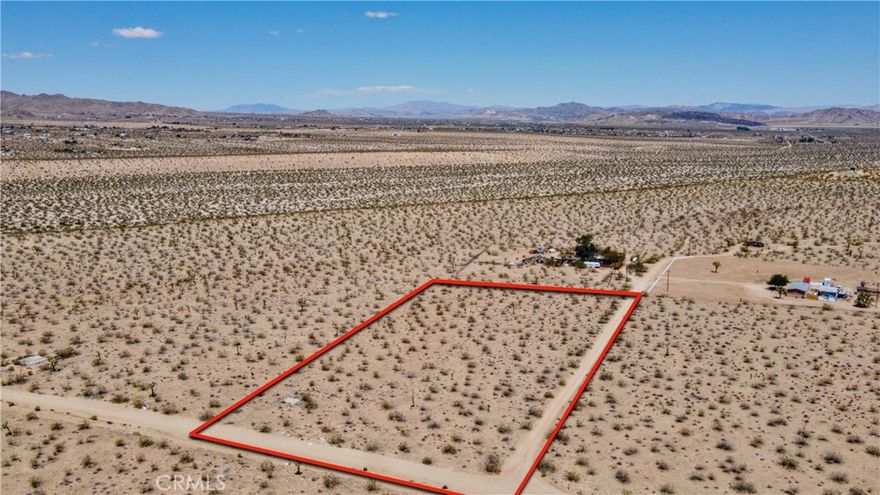 Owner May Carry! 5 Acres Of Prime Desert Land Adjacent To BLM Land! Unleash your imagination with this extraordinary 5-acre parcel of land, offering breathtaking panoramic views that will leave you in awe! Located in the stunning Yucca Mesa area of the high desert, this expansive lot showcases an open landscape adorned with striking Joshua trees and majestic mountains, creating a picturesque setting straight out of a dream. The County of San Bernardino has approved the potential for a main home plus an additional five units on the property, making it a remarkable opportunity for both personal and investment pursuits.



This secluded gem is just far enough down a dirt road to provide you with the peace and serenity you desire, yet conveniently close enough to avoid a lengthy drive. Imagine waking up to the stunning vistas that stretch as far as the eye can see, with the vast and open desert landscapes harmoniously juxtaposed against the backdrop of gorgeous mountains.



With a legal address already established, the path to developing your vision becomes even smoother. Plus, the availability of water and power nearby enhances the property’s appeal, making it the perfect canvas for your dream home, secondary residence, or an investment opportunity. 



Experience the vastness and tranquility that the high desert is known for, all while being just a quick 15-minute drive from the iconic Joshua Tree National Park and conveniently close to shopping and dining. Don’t miss out on this chance to own a piece of paradise and create something truly special!