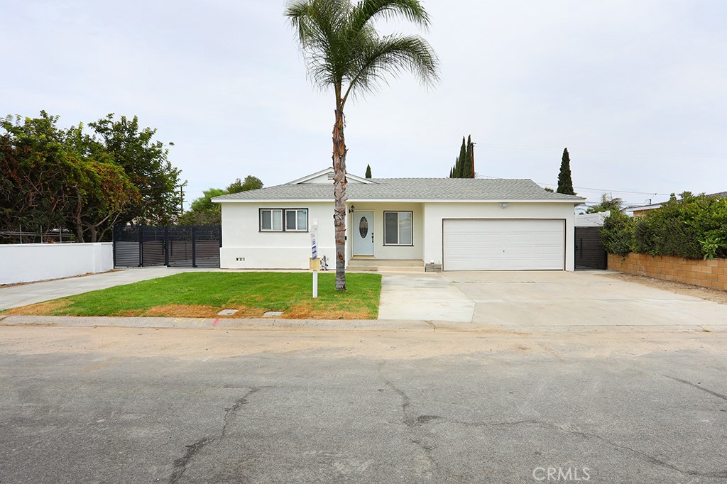 This rare Garden Grove opportunity offers the perfect combination of luxury living, income potential, and energy efficiency. Situated on a spacious 8,040 sqft lot, the property features a fully remodeled main home and a brand-new ADU, making it ideal for multi-generational living or as a high-performing rental investment. The main residence offers 1,503 sqft of thoughtfully redesigned living space, complete with 4 bedrooms and 3 bathrooms, fully remodeled with city permits. The largest bedroom with an exterior door that can be converted to a JADU for in-laws or simply for extra rental income. The newly built ADU adds 1,200 sqft of additional living space, highlighted by soaring 10-foot ceilings, 4 bedrooms, and 3 bathrooms. Designed with comfort and style in mind, and high quality kitchen and bathroom finishes. With a combined total of 2,703 sqft, 8 bedrooms, and 6 bathrooms across both residences, this property delivers remarkable flexibility. Energy efficiency is another major advantage, with a fully paid solar system offering long-term savings. The large lot provides ample parking and outdoor space for entertaining or relaxation. Conveniently located near shopping, dining, schools, and freeway access. This is a property you won’t want to miss. Schedule your showing today!