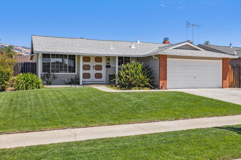 Welcome to 2864 Haughton Drive. This beautifully maintained 3-bedroom, 2-bathroom home offers 1,320 sq. ft. of comfortable living space on a 6,000 sq. ft. lot in the desirable Evergreen area. Step inside to find freshly painted interior and exterior, new waterproof laminate flooring, central heating and A/C for year-round comfort. The kitchen features a Kenmore electric stove, overhead exhaust fan, & Kenmore Elite French door refrigerator. The inviting living/dining area showcases painted wood paneling, while the family room boasts a brick-surround wood-burning fireplace, exposed beams, and direct yard access. The remodeled hall bath offers a modern tile shower with glass doors, updated vanity, and stylish fixtures. The primary suite includes large closets, a private bath with shower stall, vanity, and extra storage. Enjoy outdoor living with a spacious covered patio, manicured front and back yard with sprinklers, and planter boxes ready for your vegetable garden. The 2-car garage includes a side-by-side washer/dryer. Conveniently located within a mile of Millbrook Elementary, Quimby Oak Middle, Evergreen Valley High, Eastridge Center, Evergreen Village Square, major freeways (87 & 101), and local parks including Boggini, Lake Cunningham, and Aborn Park.