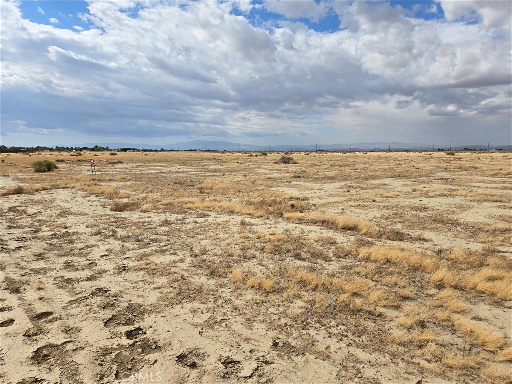 COME ENJOY THIS 2.5 +/- ACRE SQUARE PARCEL IN EAST LANCASTER. This vacant parcel is great as an investment, or build your own desert retreat! It is just "outside" of town, yet close enough to shop and dine. Buyer to verify any future use of this parcel with the appropriate authorities and utility companies.