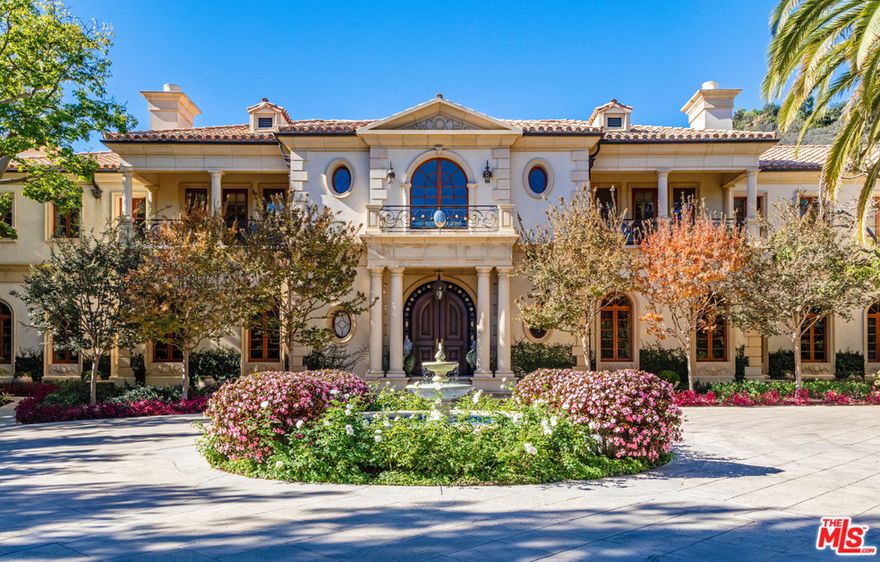 Inside the exclusive enclave of North Beverly Park rests this Mediterranean estate on approximately 3.6 acres. The main level features a grand two-story foyer that flows seamlessly to the living room with outdoor patio, a wood-paneled office and family room with bar, formal dining room, and downstairs guest room. The fully equipped kitchen with adjacent breakfast room has staff facilities. Upstairs includes the sumptuous master bedroom with dual bathrooms and walk-in closets, fireplace and a massive terrace overlooking the property. Additionally, there are four en-suite bedrooms, office and entertainment wing with built-in bar and media room. The grounds feature a pool with dual spas, pool house with kitchen, outdoor dining pavilion, firepit, floral and vegetable gardens, North/South sunken synthetic turf tennis court, 6 car collectors garage, and large motor court with staff parking. Incredible offering in Beverly Hills most coveted and guarded community.