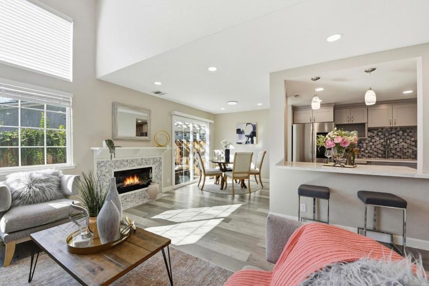 MODERN luxury EAST-facing, READY-TO-MOVE-IN Hillside HOME in a Planned Unit Development (PUD), where residents own both their HOME & LOT. Beautifully UPDATED HOME features HIGH ceilings, LOTS of NATURAL LIGHT that instantly makes each day feel Bigger, Brighter, & Calmer. *Spacious GREAT Room: Creates an OPEN, luxurious feel like a Single-Family Home! *CHECK OUT 3D WALK-IN TOURS & Professional Photos/Videos: It's like being at Home. *Stunning Modern KITCHEN: Stylish cabinetry, SS Appliances, QUARTZ Countertop & & Hexagon tile backsplash. *REST with a View: Upstairs BEDROOMS overlook serene HILLSIDE vistas, walking trails, & even HORSES passing by, a rare Daily joy. *Updated Bathrooms: Frameless backlit mirrors, Built-in Bluetooth speakers & NEW bidet seats. *Modern FEATURES: DP windows, LED lights, FIREPLACE, Ceiling fans, HVAC system, Storage Rack, Water Softener, Water Heater & MORE. *Interior upgrades include Fresh Paint, Laminate Wood Flooring, & Tile-finished bathrooms. *Smart Garage & Utilities: Attached 1-car GARAGE w/TESLA charger. *Private PATIO Backyard: Ideal for RELAXING/ ENTERTAINING w/PRIVACY. *Desirable Los Coches Villas Quiet Community   *Easy access to Hwy 680/880, CA-237,  BART & ALL Amenities It's a Place that elevates your EVERYDAY.