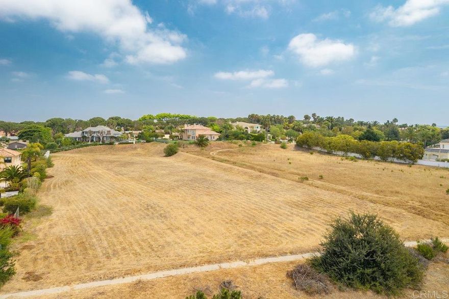 The land consists of 2 lots into one.  Two lots cannot be separated.  APN 152-0-242-345 (Bottom): 47,044 sqft ( ~1.08 acres) and APN 152-0-242-195 (Top) : 23,043 sqft (~0.53 acres).  Total is ~1.61 acres.    Exceptional 1.61-Acre Land Opportunity in Prestigious Spanish Hills. An incredibly rare offering in one of Camarillo’s most exclusive and sought-after neighborhoods—this expansive 1.61-acre parcel presents a unique opportunity to build your dream estate. Located just a quarter mile from the main gate of the Spanish Hills Country Club, this premium lot is nestled within a resort-style living.