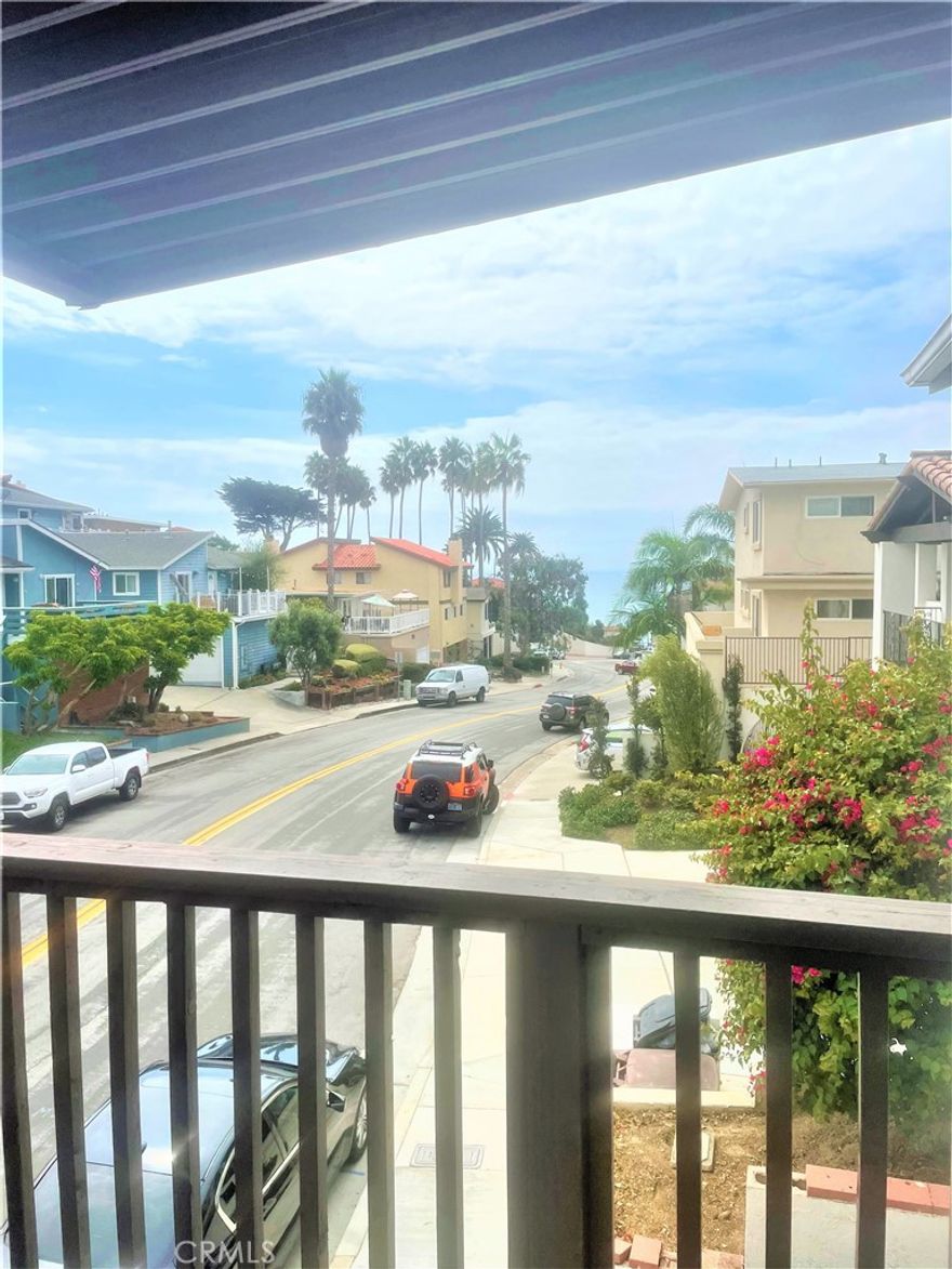 This stunning 3-bed unit has been upgraded to offer a cozy beachside living experience. Ideally located near the San Clemente Pier, Amtrak, and Metro Link, this one-of-a-kind unit boasts a huge private backyard and a shared balcony with beautiful ocean views. The living room features large windows that fill the space with natural light and offer stunning views of the ocean. Additional features include in-unit laundry, a grey brick working fireplace, and a private detached garage with space for 1 car ($125/MO). The original hardwood floors have been refurbished and add character and charm to the space. The kitchen is a chef's dream, with granite countertops, a spillover island perfect for two bar stools, and stainless steel appliances (including a dishwasher). The master bedroom is a spacious and tranquil retreat, while one of the guest rooms features charming board and batten detailing that creates a cozy atmosphere. Don't miss the opportunity to call this exceptional unit your own!