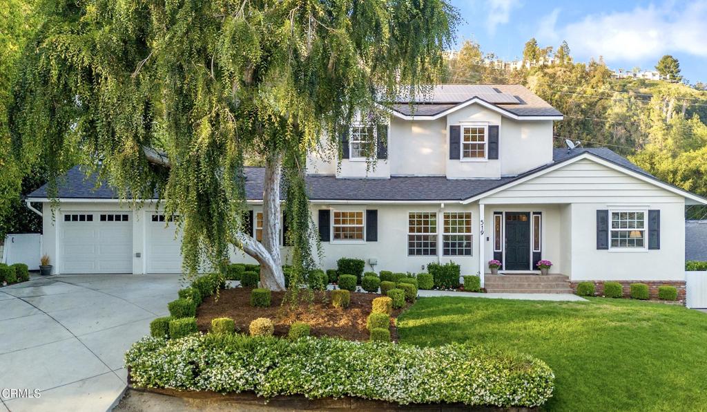 Experience Elegant California living at 519 Paulette Place. A beautifully remodeled 5-bedroom, 4-bathroom home nestled on a quiet street in the heart of La Canada Flintridge. This spacious and thoughtfully updated residence combines timeless elegance with modern comfort, offering the perfect setting for both relaxed living and stylish entertaining. Inside, you'll find an inviting sunlit living room featuring hardwood floors and a brick fireplace that opens to a cozy family room with sliders to the backyard. The remodeled kitchen is a chef's dream with quartz countertops, stainless steel appliances and an oversized island. The dining room is a beautiful space or enjoy a more casual experience in the eating area off the kitchen. The main level offers two bedrooms and two bathrooms, making it suitable for residents, guests, or office space. Upstairs, the serene primary suite, featuring a spacious closet and spa-like bathroom with marble double vanity. Two additional bedrooms and a full bathroom provide comfort for everyone. The backyard boasts two patios, a serene pond and a terraced path to a peaceful view of the city and local mountains. The home has paid-off solar panels with battery back-up, EV charging, mud room, separate laundry room and attached 2 Car Garage. Nestled behind the lush greens of the La Canada Flintridge Country Club and located in the award-winning La Canada Unified School District, just minutes from Paradise Canyon Elementary. Nearby are parks, trails, shopping and dining. This home offers the perfect blend of location, luxury, and lifestyle.