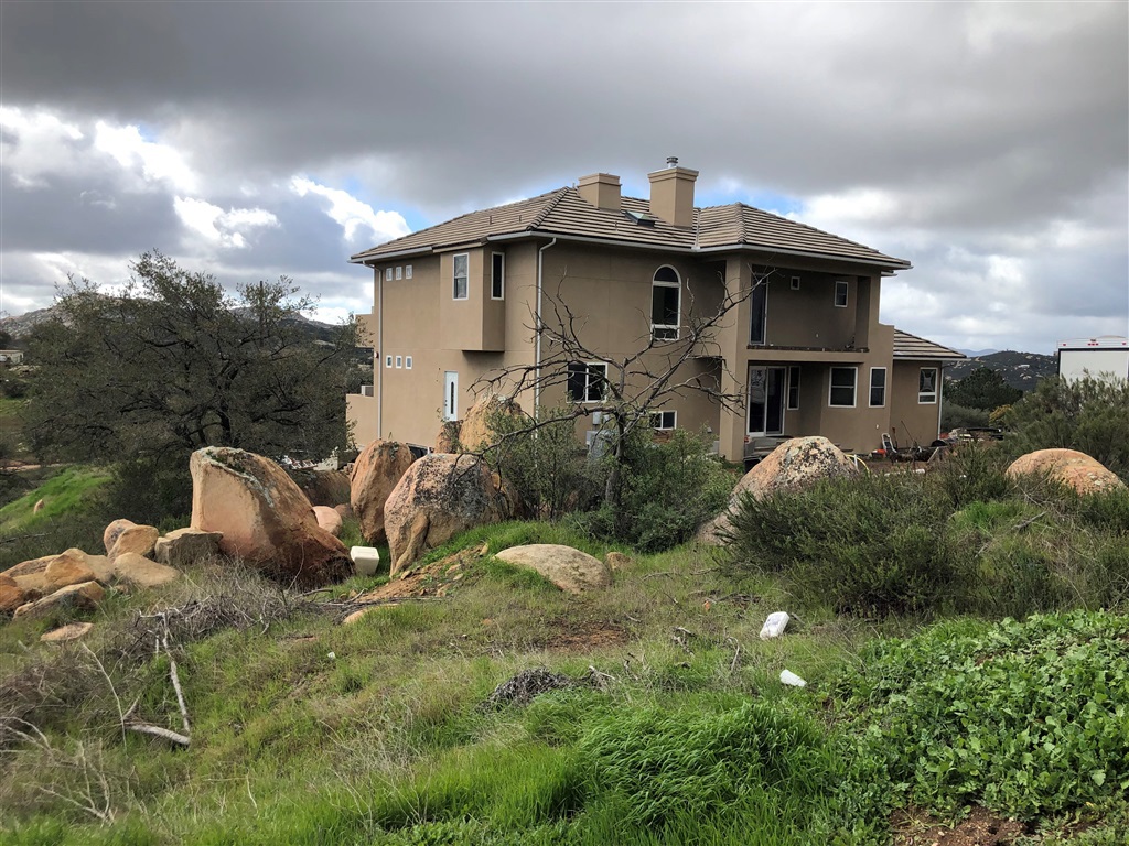 One-of-a-Kind, unfinished, custom-designed estate. Property is fully-permitted, but requires final. Home is situated on 5.3 acres with remarkable views and many high-end finishes and upgrades. When completed, home will boast a grand entrance with stone features, mesquite flooring throughout, vaulted ceilings, and 2nd & 3rd floor decks on both front and back of the home. Master suite complete with spa bathroom; 2nd & 3rd bedrooms share convenient Jack-n-Jill bathroom. Uninstalled Solar System included. Chef's kitchen features Custom Cabinetry, Soapstone counter tops, Built-in propane/induction range w/ grill, 4 ovens, Sub-Zero dual Fridge/Freezer, and Dishwasher. Kitchen opens to breakfast nook and family room with fireplace. Windows & sliders throughout the home are dual-paned, etched glass. 3 wood-burning fireplaces with inserts in LR, FR, & MBR. Home includes Safe-Room/Fire Escape room, plus many fire-safety features.. Neighborhoods: Deerhorn Valley Equipment: Dryer, Washer Other Fees: 0 Topography: RSLP