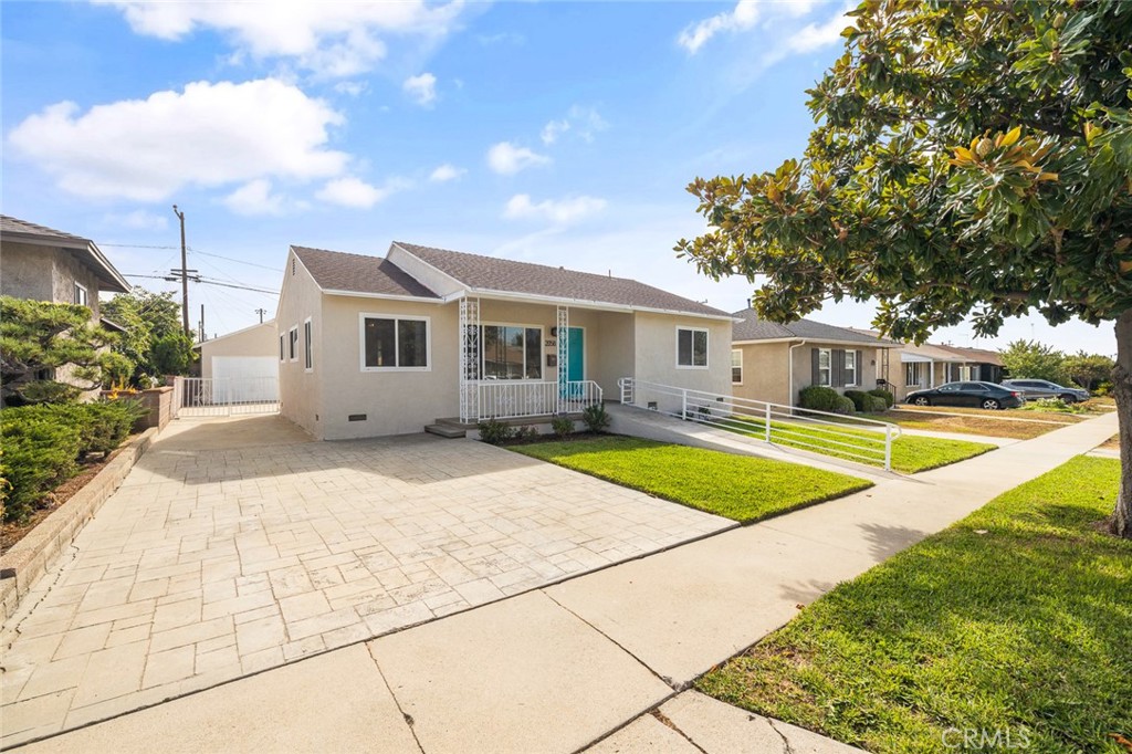 Welcome to 2058 Vancouver Ave, a charming 3-bedroom, 2-bathroom home in the heart of Monterey Park. Recently painted inside and out, this residence offers a warm and inviting atmosphere. The living room and bedrooms feature beautiful wood flooring, while the kitchen and bathrooms are finished with durable tile flooring. Enjoy the convenience of washer and dryer hookups, central heating and air conditioning, and a 2-car detached garage with ADU potential. The home also features double pane windows, a water softener system, and fresh landscaping with new plants in the front yard. The backyard includes fruit trees and offers endless potential for entertaining, gardening, or future expansion. The large driveway provides ample additional parking, perfect for family and guests. ADA ramps at both the front and back doors add accessibility and ease of entry. Situated near the 60 and 710 freeways, this home provides quick access to local shops, dining, and schools. A wonderful opportunity to own a well-maintained home in a desirable neighborhood.
