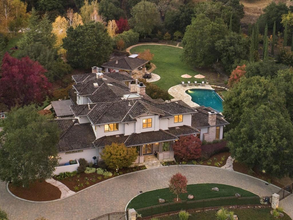 This stunning home was built by Pacific Peninsula Group at Quarry Lake, a tucked-away enclave of prestigious homes surrounding the lakeside setting. Spanning more than one acre with resort-inspired amenities as well as lake access, this gated home offers a lifestyle of luxury and privacy in a rare setting. Classic and timeless finishes extend throughout- refinished hardwood floors, refined millwork, slate, marble, and honed limestone and granite finishes. Located on a non-through street, this magnificent 5829 sf home has 5 BD/4BA, 2 powder rooms, executive study, tremendous kitchen and step-down formal living room. The outdoor amenities include an infinity-edge pool and spa, fireplace terrace, separate barbecue terrace, plus putting green, BB court (with regulation keys), soccer-worthy lawn. Adjoining is a vast heated entertainment pavilion w/outdoor kitchen, which includes barbecue, sink with hot water and disposal, Sub-Zero refrigerator, and ample cabinets, along with a half-bath.