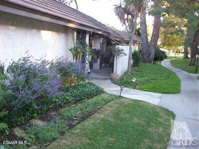 Much sought after true single level condo in Village Green. Premier location within the communiity. Newer kitchen and baths. Woodliike flooring throughout. New window treatments on sliders in living room.Dual pane windows on sliders, smooth ceilings, ceiling fans and crown molding. Travertine floors in the baths. The kitchen has granite counters and stainless appliances. Wrap around patio for easy entertaining. Guest parking is very convenient for this unit. Detached two car garage. Two community pools, spa, basketball court and shuffle board play area. Lovel greenbelts for walking. Very close to all of the amenities Westlake Village has to offer: great shopping, restaurants, Sunday Farmer's Market, CVS pharmacy, local parks and so much more! A wonderful community to call home.