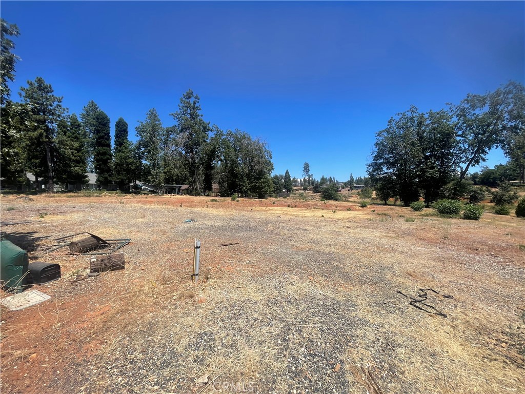 Nearly 1.5 Acres in the Heart of Paradise – Build Your Dream Home! Enjoy the beauty and potential this parcel offers of mostly flat land located in the heart of Paradise. Zoned RR1/2, this property offers space and flexibility to bring your building vision to life and potential for two homes or an ADU unit (verification required with Town of Paradise) with plenty of space for a garden, shop and more. Water service with PID is active, and prior to the Camp Fire, the site featured a spacious 2,200+ sq ft home with a large garage and shop—a perfect opportunity to reimagine your ideal home in a peaceful setting. Whether you're looking for a fresh start or a quiet place to settle, this property provides the foundation to create something truly special. Located within walking distance to schools, public transit and public services this neighborhood features MULTIPLE NEW stick-built homes. Don’t miss out—make it yours today!