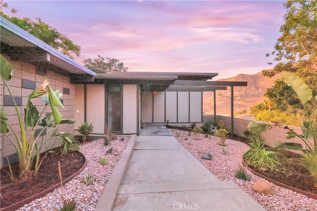 Welcome to 20289 W Point Dr., Riverside, CA — a true custom-designed contemporary masterpiece. This home belongs in the Hollywood Hills! Perched in a desirable neighborhood with elevated positioning, it offers unmatched privacy, style, and panoramic scenic views.
With an abundance of oversized windows throughout, the home is flooded with natural light and showcases stunning mountain and city vistas from nearly every room. The open-concept floor plan seamlessly connects modern living spaces with high-end designer finishes, sleek lines, and thoughtful architectural details that make this home one of a kind.
The gourmet kitchen is equipped with premium appliances and features custom European cabinetry that combines functionality with cutting-edge style. The luxurious primary suite includes a custom walk-in shower and a freestanding soaking tub, offering a retreat-like experience. Step outside to a beautifully landscaped backyard with multiple outdoor seating areas ideal for relaxing or hosting under the stars.
Don’t miss your chance to own this Hollywood Hills-caliber home right here in Riverside — where elegance meets everyday comfort.
