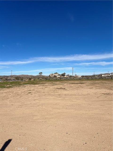 Photo of 21012 Stoddard Wells Rd, Apple Valley, CA 92307 (MLS # HD25269547)