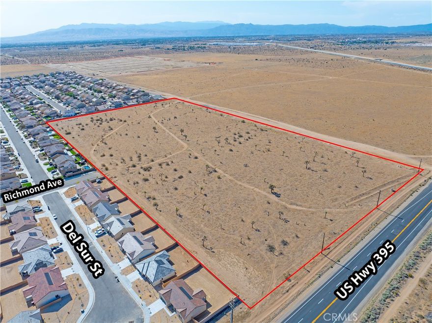 ±20 acres of unimproved land for sale on the corner of Highway 395 and Mesa St in Victorville; APN: 3136-351-01. This lot features 10 Commercial (C-2) acres providing approximately 650 ft of frontage on Highway 395 and 10 acres of Single Family Residential (R-1) permitting the development of up to 5 dwelling units per gross acre. Water, sewer, and power are available at site. This site abuts LGI Homes Desert Willow Village, currently under construction with homes already selling. Neighboring businesses/amenities include the Mall of Victor Valley, Target, Ross Dress for Less, Marshalls, Lowes Home Improvement, Kohl’s Department Store, Best Buy, Walmart Supercenter, Cracker Barrel, Golden Corral, Habit Burger, and more. This location is also near the future Hesperia Station for the high-speed rail being developed by Brightline West. Connecting Downtown Los Angeles to the Las Vegas Strip, the rail is expected to break ground in 2023 and bring more than 10,000 jobs to the area. Buyer to verify all information contained herein. Agent and their representatives are not responsible for the accuracy of these claims.