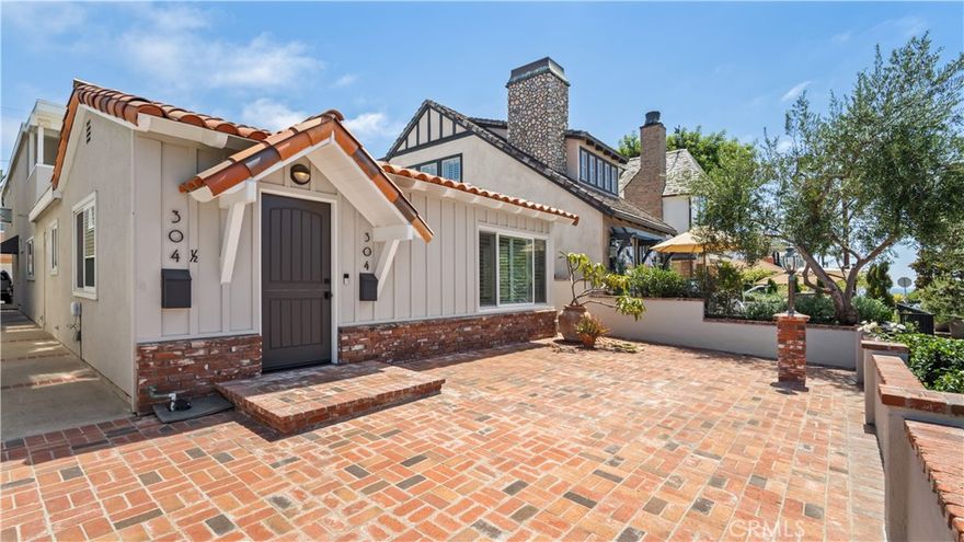 Experience elevated beach living in this single-level home just blocks from the sand in the heart of Corona del Mar. Located on the coveted 300 Block of the Flower Streets, this front-unit SFR residence blends high-end finishes with a laid-back coastal style. Tucked away on a quiet, non-through street, the home offers a rare combination of privacy and walkability. Enjoy ocean views and salty breezes from the spacious front patio, or unwind in the private serene pergola atrium—a serene space ideal for yoga, meditation, or your morning coffee. Inside, the open-concept layout features Saltillo tile flooring, beamed ceilings, and natural light throughout. The thoughtfully designed kitchen is equipped with stainless steel appliances, quartz countertops, custom cabinetry and dining area. With three bedrooms and 2.75 bathrooms, the home is both comfortable and functional. The primary suite includes a walk-in closet, dual vanities, and a spa-inspired shower with custom tile and multiple shower heads. Two additional bedrooms share a modern bath with dual sinks and a walk-in shower. Highlights Include: Fully equipped kitchen, In-unit stackable washer/dryer, Private atrium-style courtyard, 2-car garage, Gas fireplace, Saltillo tile accents, and modern finishes. Just a short stroll to Corona del Mar’s finest restaurants, boutiques, cafés, and beaches. Minutes to Fashion Island, John Wayne Airport, and the best of Orange County’s coastal lifestyle. A rare opportunity to lease a refined, stylish beach home in one of CDM’s most desirable locations.