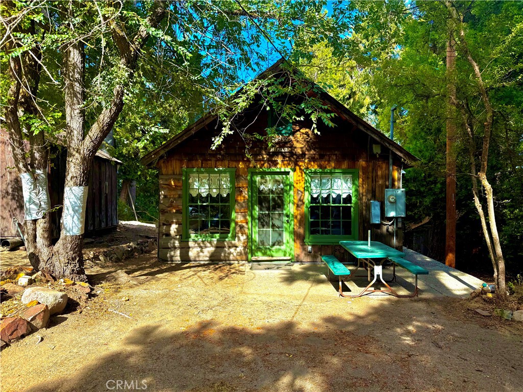 Back on Market after Recent Upgrades! Tucked away in the tranquil woods, this charming 1-bedroom, 1-bath cabin is now even more inviting and move-in ready. With thoughtful improvements already completed, the home offers the perfect balance of character, comfort, and opportunity.
Inside, you’ll find fresh interior paint, new Prego laminate wood flooring, updated light fixtures, ceiling fans, a newly-hand crafted staircase in the back and a new water heater. Glass pane updates bring in natural light, while ample attic storage space makes the cabin as practical as it is cozy. A generous firewood supply ensures you’ll stay warm on crisp mountain nights.
Whether you’re seeking a peaceful weekend retreat or a full-time mountain escape, this property delivers a warm and welcoming layout with room to make it your own. With the hard work already started, all that’s left is adding your personal touch.
If you’re looking for a cabin with rustic charm, and the potential to continue building value, your mountain retreat is waiting.