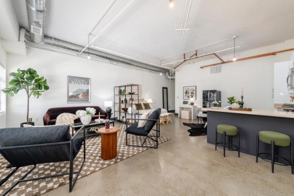 Modern Loft Living in the Heart of West Oakland! Experience stylish urban living in this spacious ground-floor unit at the sought-after West Grand Lofts. Designed with an open-concept layout, this home features soaring ceilings, oversized windows, and polished concrete floors that create a sleek, modern vibe. The unit offers a well-appointed kitchen and bathroom, in-unit laundry, ample storage, and the convenience of a gated community. Your dedicated parking space is located on the same level-just steps from your front door-making daily living exceptionally easy and accessible.Enjoy the vibrant local scene with neighborhood favorites like Ghost Town Brewing, Soba Ichi, and a variety of popular cafes and restaurants nearby.Ideally situated close to West Oakland BART, Downtown Oakland, Lake Merritt, and major freeways, this location is perfect for commuters and urban explorers alike. Own your home in a prime West Oakland location-stylish, convenient, and move-in ready.