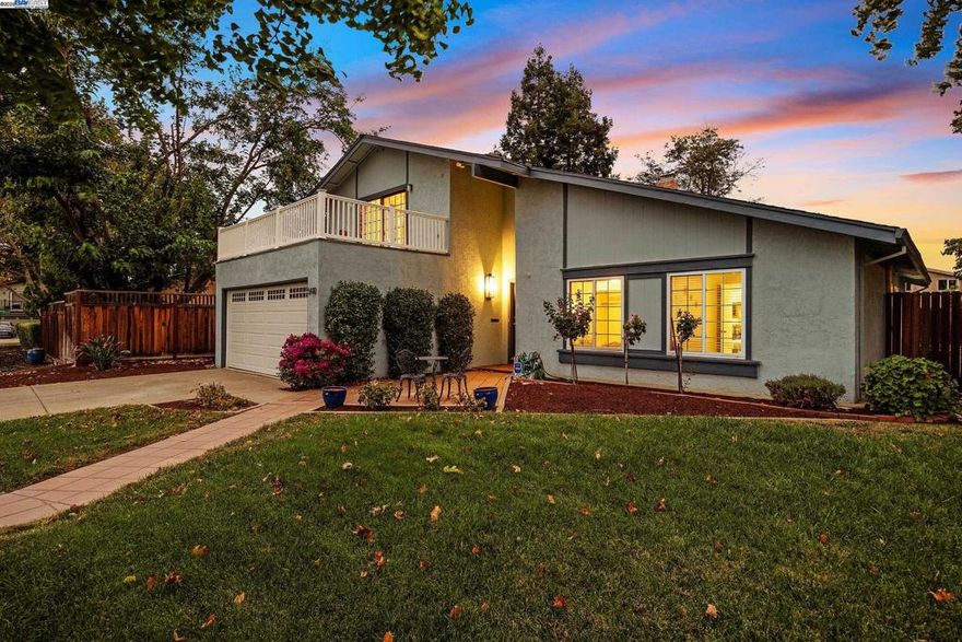 This well-maintained home is a unique opportunity in a highly desirable and quiet neighborhood. Entering through French doors, you'll discover a thoughtfully designed floor plan providing separation and privacy, making it perfect for multi-generational living or a potential income-producing rental. The main level features an open layout with hardwood floors and a gas fireplace. The bright, airy kitchen offers a large island, tile counters, and is conveniently adjacent to the laundry room. The primary bedroom has sliding doors which open to a spacious backyard, ready for your landscaping vision. Two additional bedrooms and a full bathroom complete this level.  Upstairs offers a second living space with a balcony. This level includes a small kitchen with extra storage, an additional bedroom with walk-in closet, space for a home office, and a full bathroom with dual sinks. The home's location is minutes from a large neighborhood park, the Lawrence Livermore and Sandia National Labs, award-winning wineries and breweries, hiking and biking trails, and a vibrant downtown. Commuting is a breeze with easy access to the ACE train and nearby freeways. Don't miss this one!