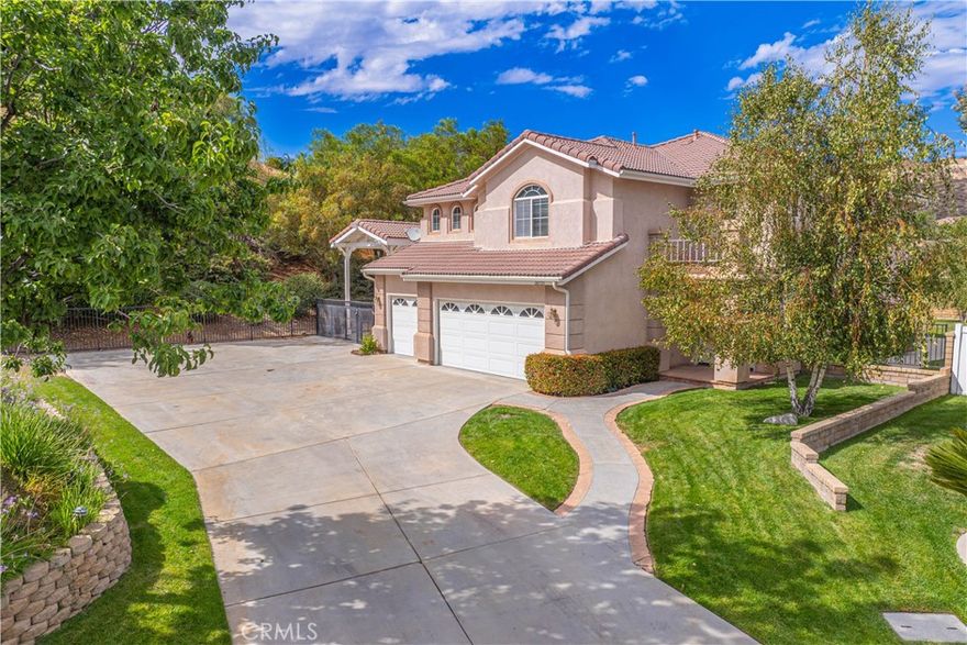 Home Is Where The Heart Is with this exceptional 4-bedroom, 3-bathroom single-family home offering 3,088 sq ft of spacious living on an expansive 30,128 sq ft lot. Perfectly tucked at the end of a quiet cul-de-sac, this private retreat provides unmatched comfort, functionality, and entertainment options both inside and out.

From the moment you arrive, the extended driveway offers parking for several vehicles, along with a 3-car garage and covered RV parking, ideal for car enthusiasts, large families, or guests. Step inside to find a thoughtfully designed floor plan featuring hardwood, tile, and carpet flooring throughout. The bright and open living spaces are enhanced by central air and heating, recessed lighting, and multiple gathering areas that blend seamlessly for entertaining and everyday living.

The kitchen is equipped with modern appliances, including a dishwasher, microwave, oven, and abundant cabinetry, making it a true centerpiece for family meals and gatherings. Adjacent to the kitchen, spacious family and dining areas provide the perfect backdrop for entertaining or relaxing evenings at home.

A huge loft adds versatile living space, perfect for a game room, home office, or additional lounge. Each bedroom is designed with comfort in mind and includes a walk-in closet, while the luxurious primary suite offers not one, but two walk-in closets, along with a private ensuite bath for ultimate convenience. 

Step outside to your backyard oasis, complete with a sparkling private pool and soothing Jacuzzi, perfect for summer barbecues, parties, or quiet nights under the stars. With nearly three-quarters of an acre, there’s plenty of room for parking your toys, gardening, or adding to your dream outdoor retreat.

Additional features include paid solar power for energy efficiency, ceiling fans, and an attached garage with direct access. Best of all, this home is within walking distance to Castaic Elementary and Castaic Middle School. The community of Castaic also offers endless recreation, a beautiful lake for fishing and boating, hiking and biking trails, swimming, shopping, dining, and easy freeway access for commuters.

Don’t miss the opportunity to own this rare private cul-de-sac property offering generous space, modern amenities, and an unbeatable location in the heart of Castaic.