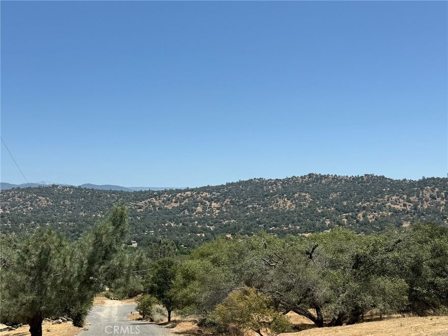 Prime Land Lot in Yosemite Lakes Park – Utilities, Privacy, & Stunning Views!



Welcome to your future oasis in the heart of Yosemite Lakes Park, where nature meets convenience. This spacious and private 1.07 acre lot offers the perfect canvas to build your dream home, vacation getaway, or investment property. Nestled in a peaceful setting, you'll enjoy breathtaking views, serene surroundings, and the comfort of utility hook-ups already in place.



Located in a quiet section of the community, this lot provides natural privacy with mature trees and gentle topography, ideal for those seeking tranquility and connection to nature.



Property Highlights:

- Equipped with utility hook-ups

- Gorgeous views of rolling hills and wooded landscapes

- Peaceful, private location within the park

- Paved road access for year-round convenience

- Located in the Yosemite Lakes Park community with amenities like a golf course, clubhouse, equestrian center, hiking trails, tennis, pools and more

- Just a short drive to Yosemite National Park, Bass Lake, and Fresno



Whether you're planning to build now or invest for the future, this is a rare opportunity to own a piece of land in one of Central California’s most desirable foothill communities. Your Yosemite retreat awaits!